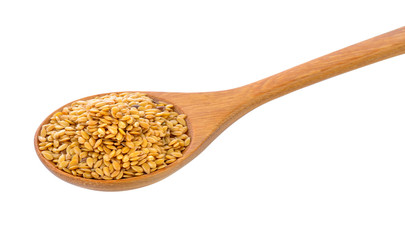 Flax seeds heap in wood spoon isolated on white background