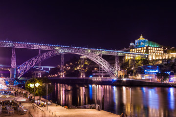 Porto by night. View of the waterfront Douro River and Luis I Bridge. Portugal