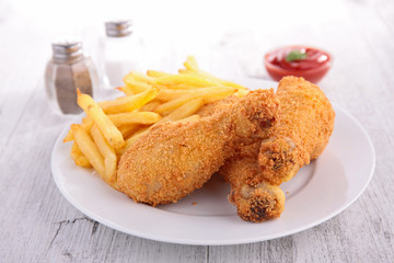 fried chicken leg and french fries