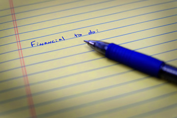 To Do List on Notebook Paper and Pen Financial