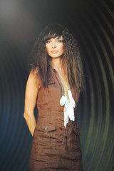 Beautiful Curly Hair. Girl With Healthy Long Wavy Hair. Portrait Of A Happy Woman With A Beautiful Face, Sexy Makeup And Perfect Hair Curls. Volume, Hair, Hairdressing Concept. High Quality