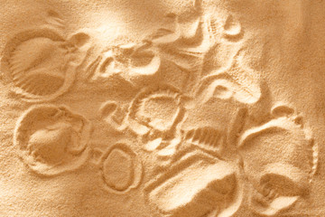 Beach sand with prints in light