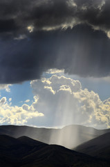 Sun Rays In Clouds and Mountains