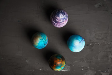 Rustic colored easter eggs on the dark stone background. Shallow depth of field.