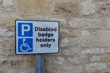 disabled or handicapped badge holder parking sign