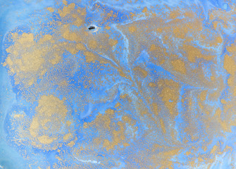 Blue and golden liquid texture. Watercolor hand drawn marbling illustration. Ink marble background.