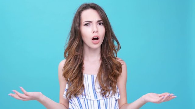 Outraged brunette young woman scolding and refusing isolated
