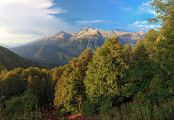 Obraz premium Beautiful scenic summer landscape of Caucasus mountains with blue sky and Chugush Peak on background