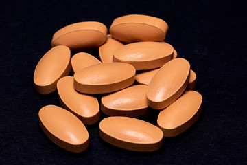 Medicine Pills. Tablets. Capsule.Pharmaceutical medicament, Close-up of pile of blue and green tablets - capsule. Pills and tablets on black background