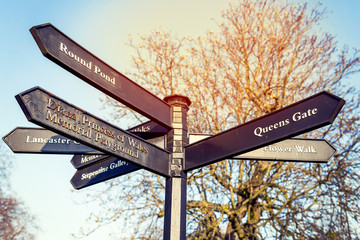 road signs in the center of London showing famous places