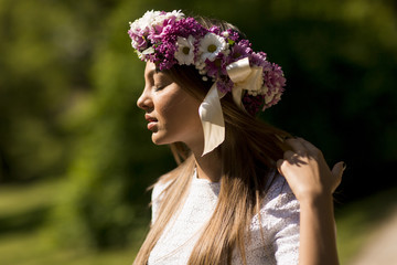 Young woman with flowers in a hair