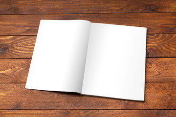 Blank book or magazine cover on wood background