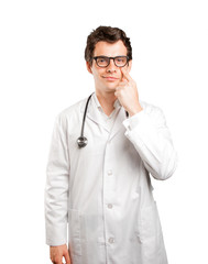 Concentrated doctor with observe gesture against white background