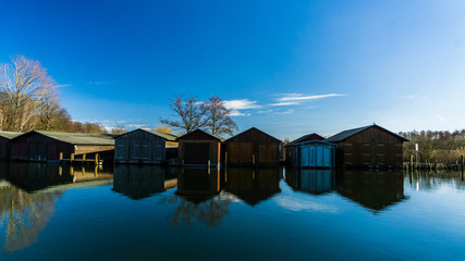 boat houses and calm river