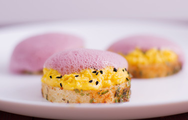 Spicy crostini filling eggs and vegetable foam