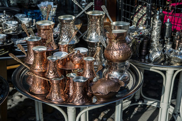 Traditional handcrafted copper coffee pots in souvenir shop in Sarajevo