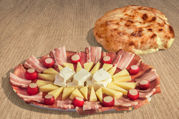 Appetizer Savory Dish Meze and Pitta Bread Loaf Set on Striped Brown Kraft Paper Background