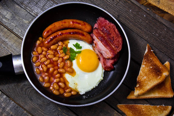 Full English breakfast on a frying pan 
