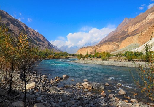 Autumn Landscape Of Ghizer River Along Hindu Kush Mountain Range In Ghizer Valley, Northern Pakistan