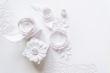 white gifts and white paper flowers