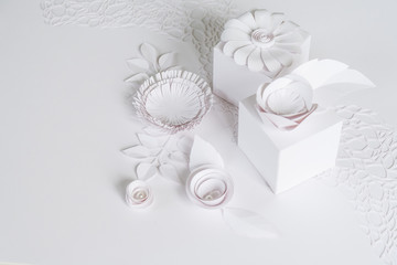 white gifts and white paper flowers