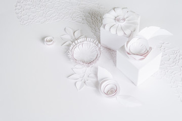 Fototapeta na wymiar white gifts and white paper flowers