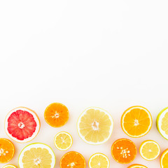 Food frame of fresh citrus on white background. Flat lay, top view.