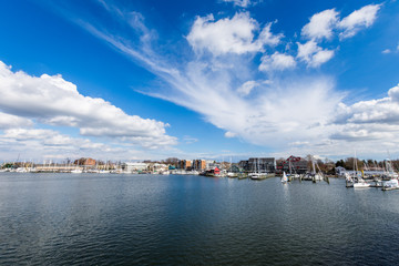 Naklejka na ściany i meble Harbor Area of Annapolis, Maryland on a cloudy spring day with sail boats