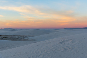 Fototapeta na wymiar colorful sunset over the white sand dunes
