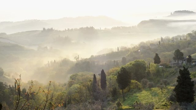 misty morning panorama from the San Gimignano walls, Toscana, Italy

