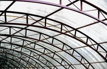 A canopy made of polycarbonate arc . Metal construction.
