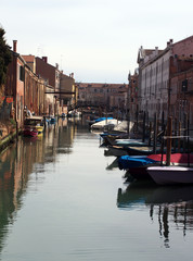 Boats moored on a venice canal