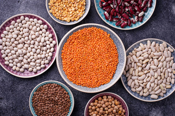 Various legumes. Chickpeas, red lentils, black lentils, yellow peas and beans