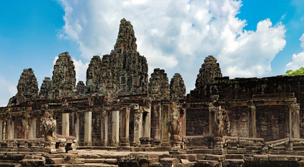 Fototapeta na wymiar Prasat Bayon with smiling stone faces is the central temple of Angkor Thom Complex, Siem Reap, Cambodia. Ancient Khmer architecture and famous Cambodian landmark, World Heritage.
