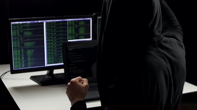 successful hacker cracked the code. He rejoices and claps his hands