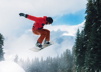 snowboarder is jumping very high