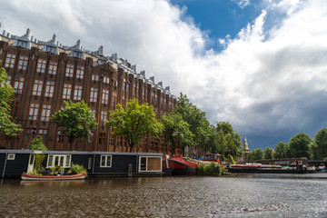 Naklejka premium Houses Along Canal