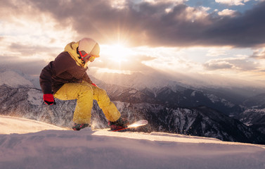 snowboarder is riding on the sunset © Аrtranq