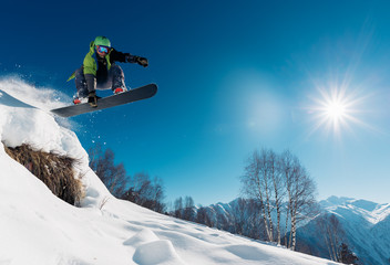 snowboarder is jumping with snowboard - obrazy, fototapety, plakaty