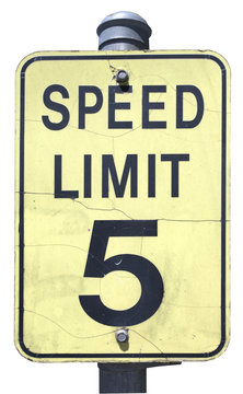 Weathered black and faded yellow SPEED LIMIT 5 sign. Isolated. Vertical.