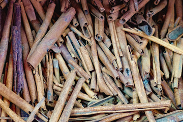 Cheap cinnamon sticks for sale in the most famous market in Chinatown district, Bangkok, Thailand. Texture of cinnamon sticks. Top view. Selective focus