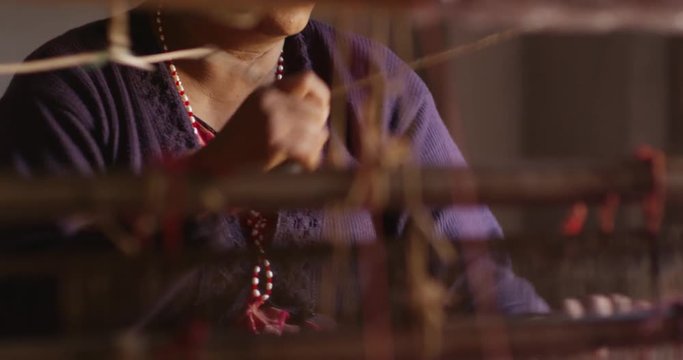 Nepali women makes a Pashmina Shawl the traditional way in Bhaktapur, Nepal