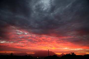 grey and pink clouds meet