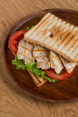 Sandwich with chicken, flat lay top view.