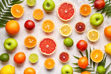 Citrus sliced harvest fruits background flat lay, helthy vegetarian organic food