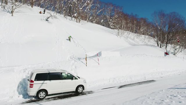 Snowboarding Big Air Jump Backflip Trick Over Road in Slow Motion Sunny Day Amazing Dangerous Extreme Winter Sports