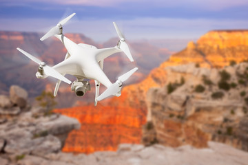 Unmanned Aircraft System (UAV) Quadcopter Drone In The Air Over The Grand Canyon.
