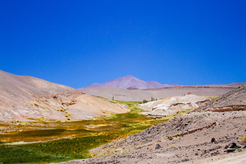 Mountain peak with green grass valley in Catamarca, Argentina