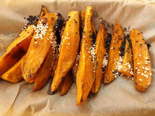 Baked sweet potato sprinkled with sesame seeds