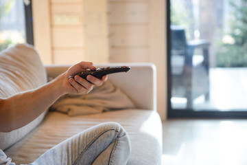 close up shot of remote controller in hand © Drobot Dean